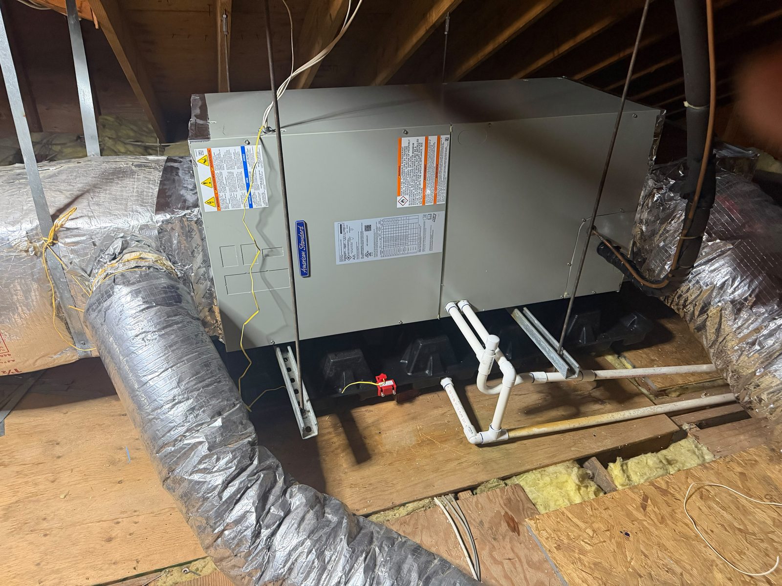 Air handler with new insulated flexible ductwork installed in a New Jersey attic